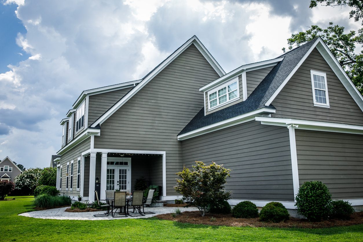 Two-story home with gray lap siding and white trim